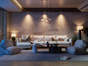 Modern living room with soft ambient lighting, featuring a white sectional sofa, sculptural glass pendant light, neutral-toned decor, low round coffee table, floor cushions, and textured wall with recessed lighting accents.