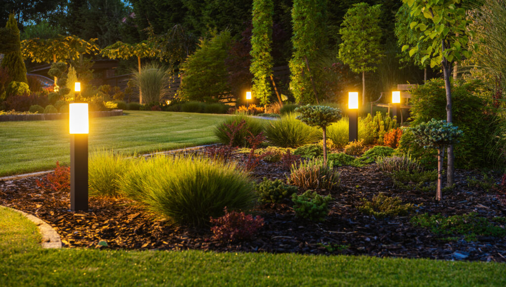 Illuminated outdoor garden pathway with modern landscape lighting, showcasing opportunities in outdoor lighting franchises.